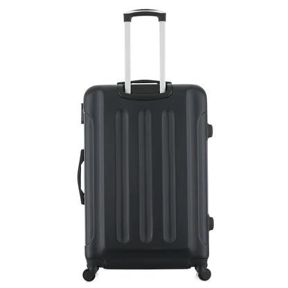 Grande valise rose de dos
