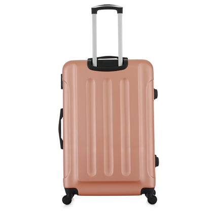 Grande valise rose de dos
