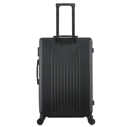 Grande valise noire de dos
