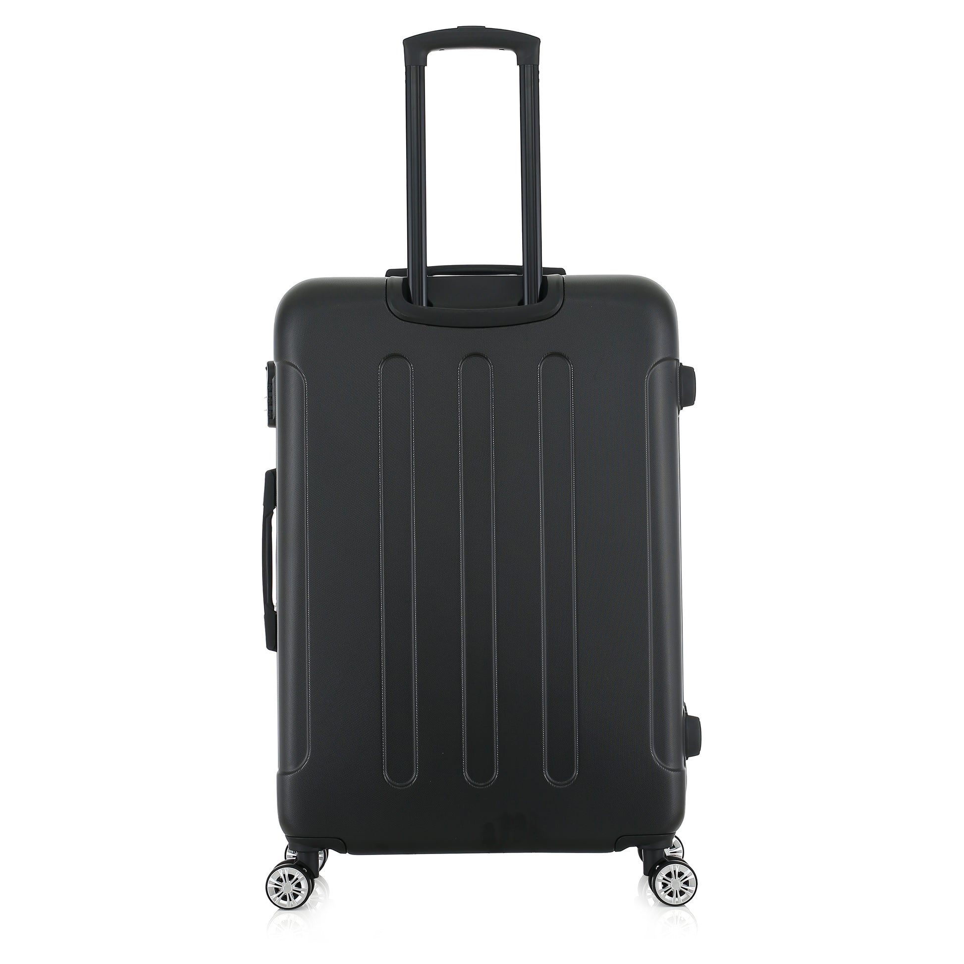 Grande valise noire de dos
