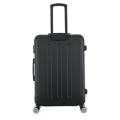 Grande valise noire de dos
