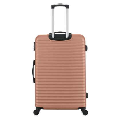 Grande valise rose de dos
