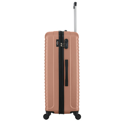 Grande valise rose de côté
