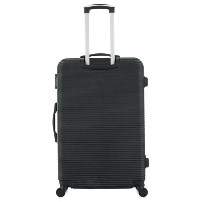 Grande valise noire de dos
